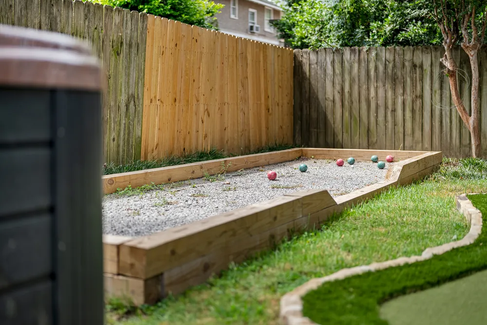 The bocce court with balls on the gravel.