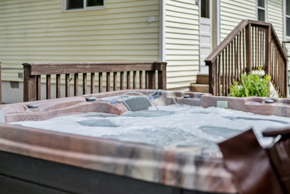 The hot tub beside the back steps.